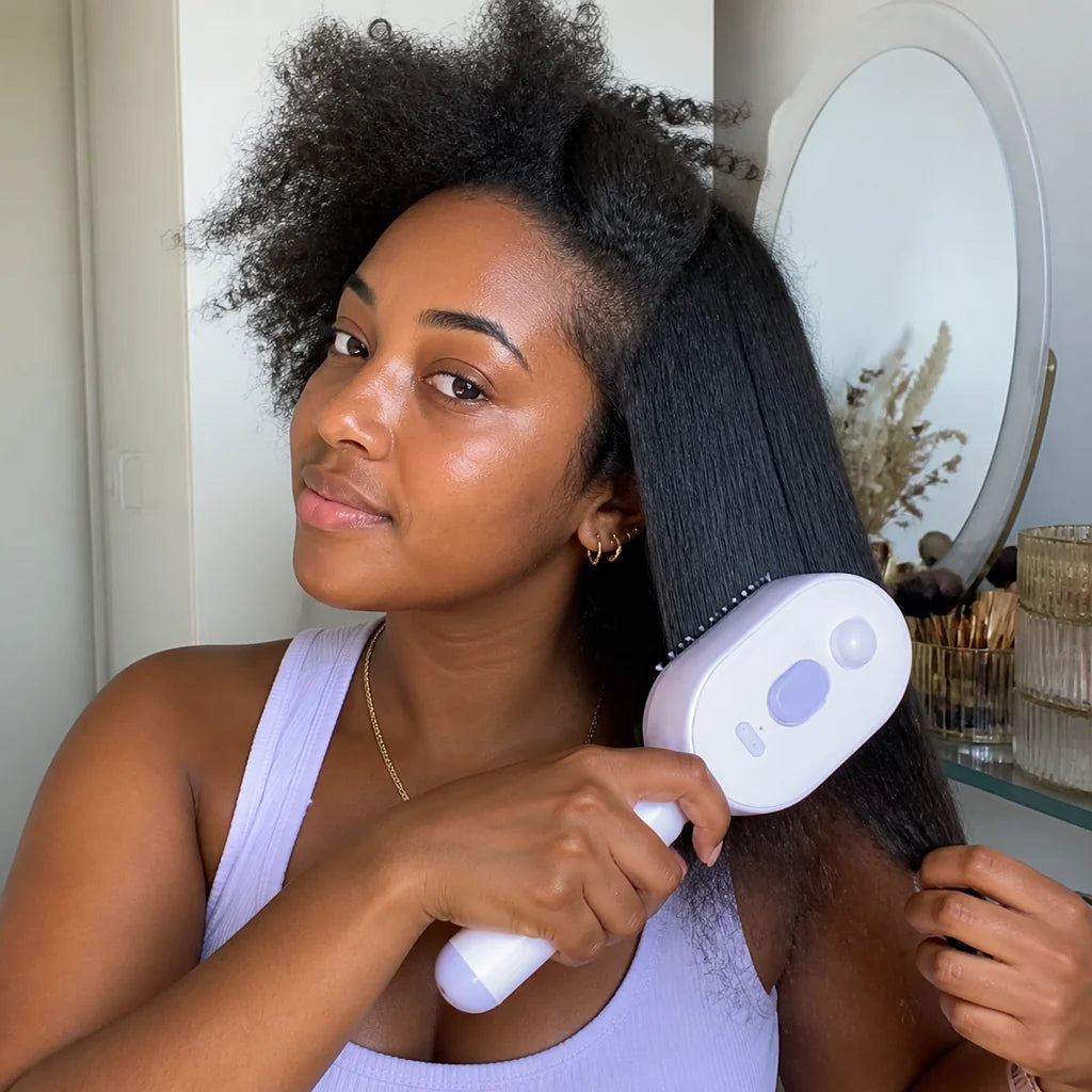 Customer using Mistglide Brush by a hallway mirror