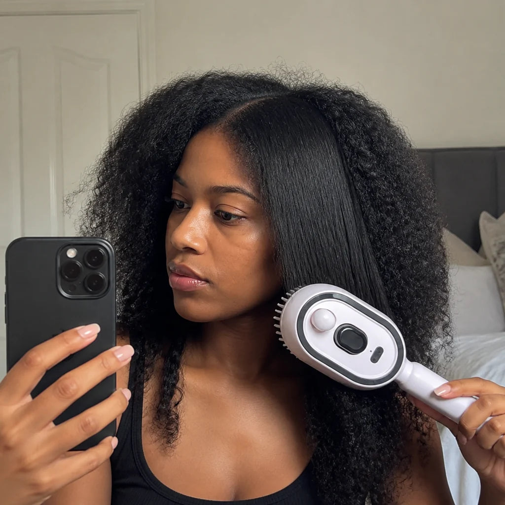 Customer brushing hair with Mistglide Brush at home