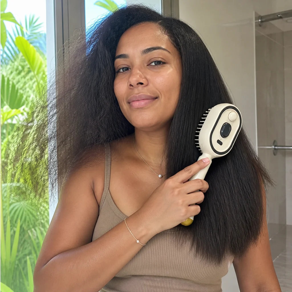Customer using Mistglide Brush in a restroom mirror